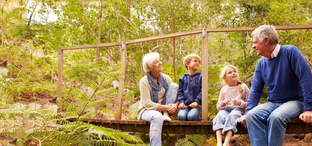 grandparents with grandkids in forest